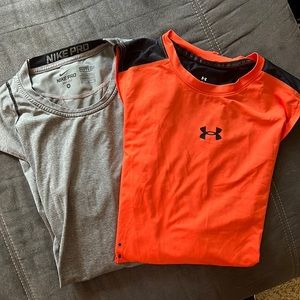 Two men’s wicking tops, Nike and under Armour